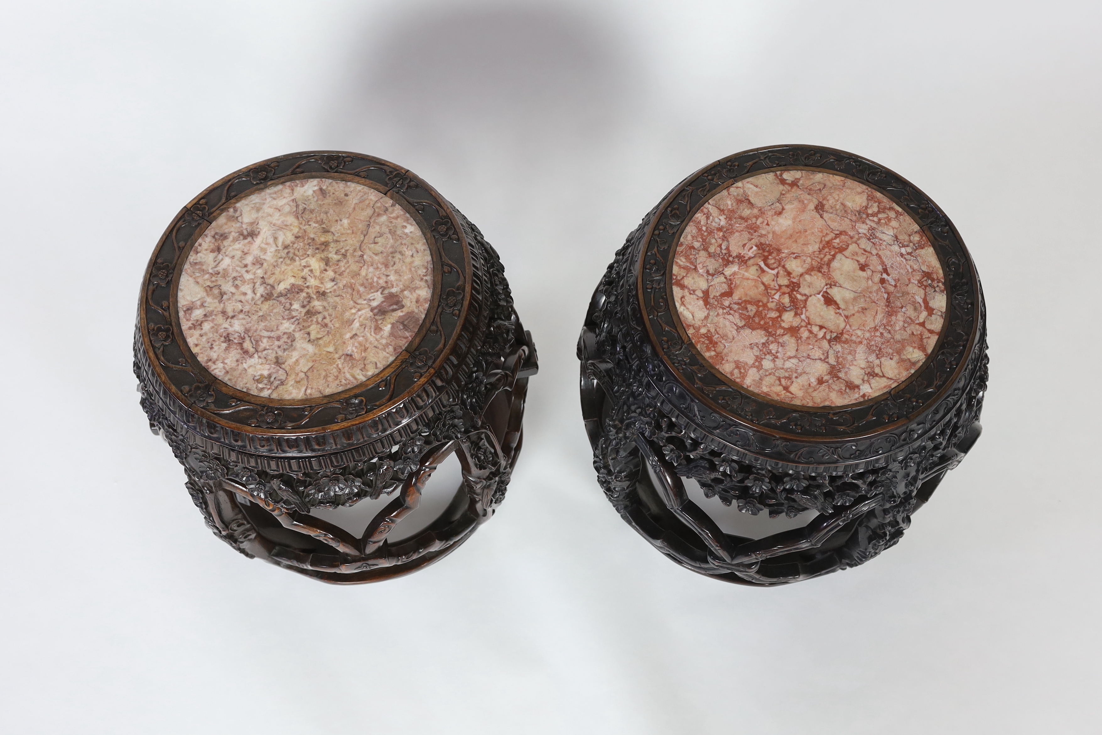 A near pair of Chinese hongmu and rouge marble inset stools, late 19th century